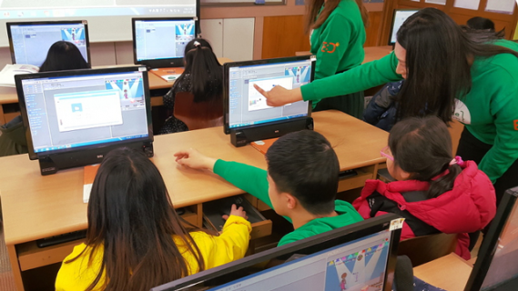 Students using laptops to learn coding