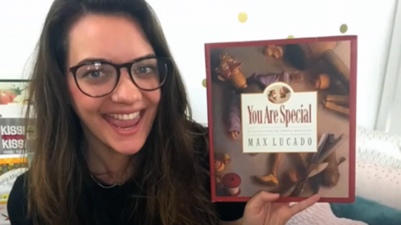 Ashleigh Best holding up a book called 'You are special'