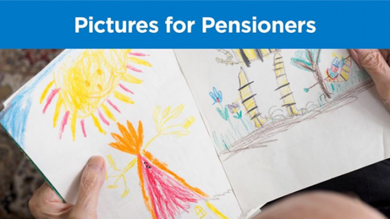 Person holding several pages with childrens' drawings on them